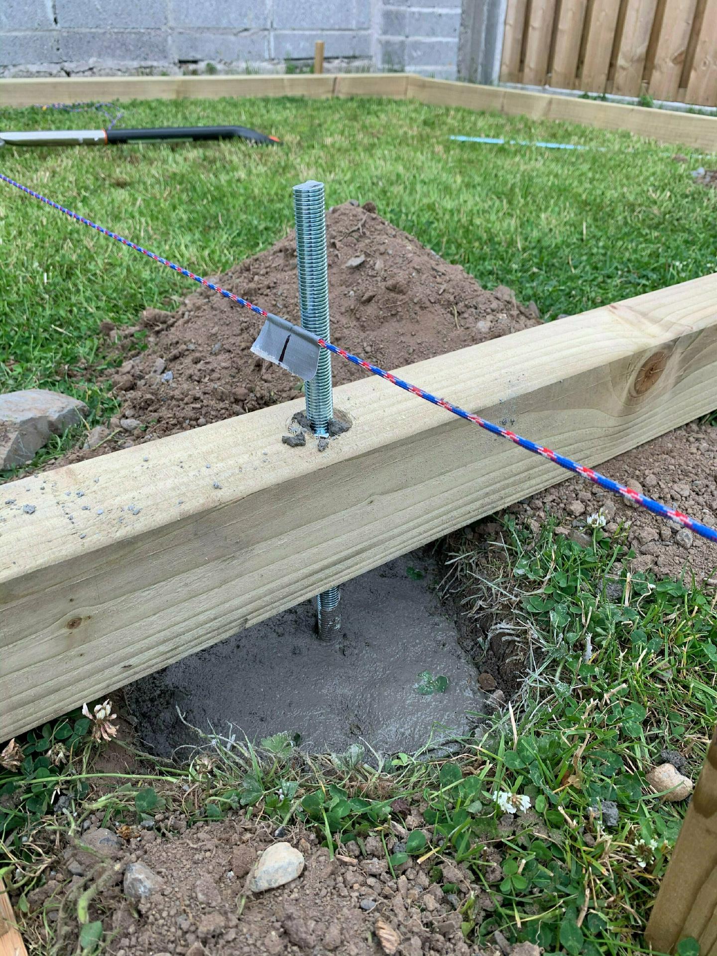 Pouring the concrete foundation posts